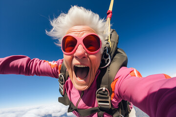 Funny and smiling elderly woman has fun skydiving