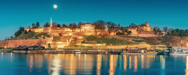 Fototapeta na wymiar iconic Kalemegdan: A symbol of Serbia's capital, where people gather to admire the historic fortress and panoramic views at full moon at night