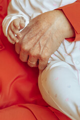 Grandmother Holding Little Child in Her Hands - 735907294