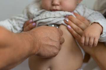 Pediatrician hold stethoscope exam baby. Children medical care