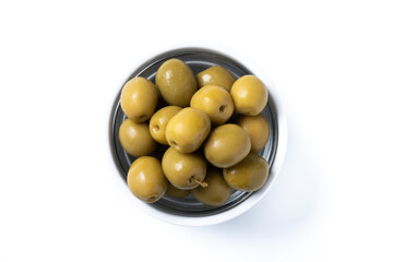 Green olives in white bowl isolated on white background. Top view