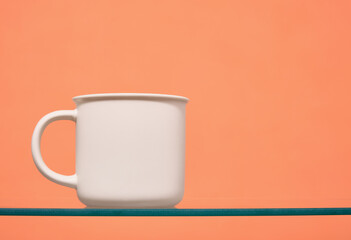 Minimalistic composition with tableware. White cup for various drinks. Copy space for text.