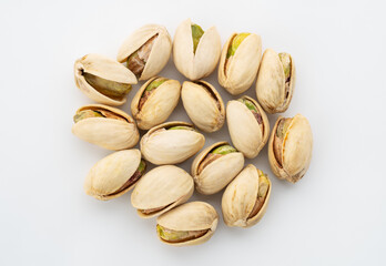Salted Pistachios for Beer, Macro, Spin. Isolated Background of a Beer Snack of Salted Pistachio Nuts. Healthy Delicious Pistachios. Salted roasted pistachio macro	
