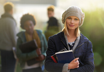 Student, woman and portrait with books outdoor, education and learning material in winter for...