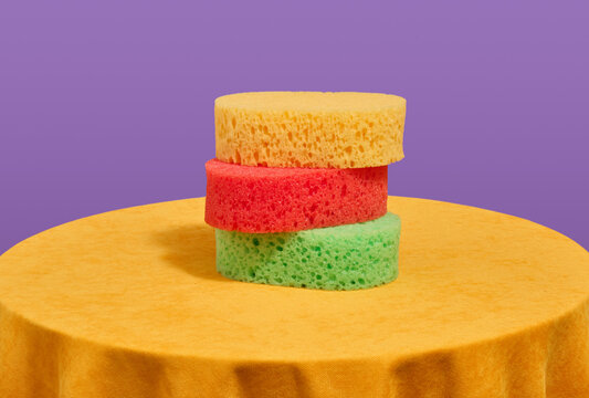Three brightly colored shower washclothes. Skin routine in bathroom.