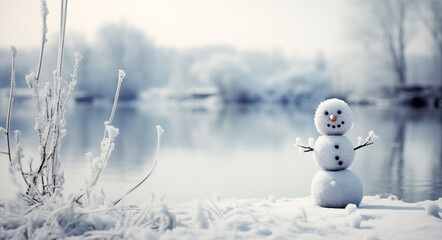 Fototapeta premium Small snowman against a backdrop of snow and a river, evoking a charming winter scene with a serene ambiance, perfect for seasonal greetings, winter-themed designs, or adding a touch of whimsy
