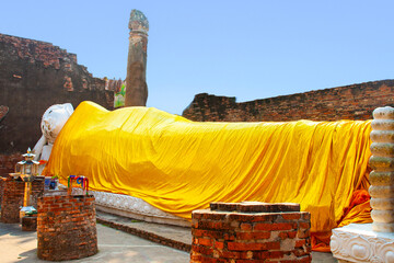 lying Buddha dressed in yellow scarf in temple Wat Yai Chai-mongkol