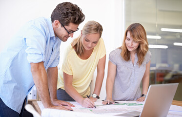 Architecture, blueprint and team in office with laptop, strategy and project management meeting....