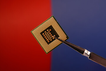 Microprocessor close-up on a red and blue background.