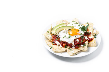 Traditional Mexican breakfast red chilaquiles with egg isolated on white background. Copy space