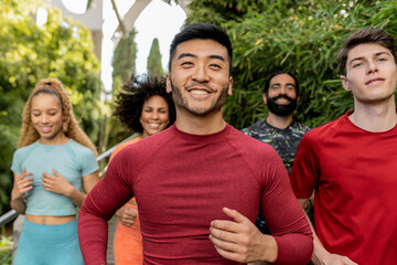 Obraz premium portrait Asian man runner with his friends following the race behind - Exercise, jogging and sport concept