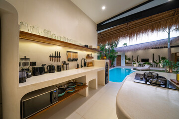 Fototapeta premium Modern villa, interior, beautiful kitchen in tropical villa