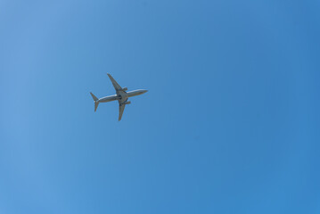 Airplane flying in the blue sky