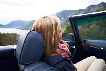 Woman, relax and convertible or road trip outdoor on vacation or travel destination, adventure or...