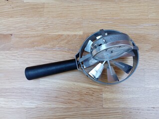 Manual metal anemometer with a propeller and a sensor for measuring wind speed. A device used at...