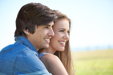 Fototapeta premium Couple, smile and hugging in nature, love and care in relationship on outdoor date. Happy people, embrace and relax on holiday or vacation, bonding and romance on adventure and travel for getaway