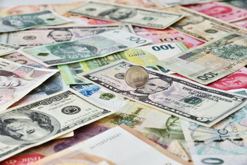 Financial background. Different banknotes: American Dollars, Euro, RMB, Turkish liras, Czech korona and Polish zlotych.