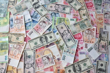 Fototapeta na wymiar Financial background. Different banknotes: American Dollars, Euro, RMB, Turkish liras, Czech korona and Polish zlotych.