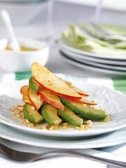 Avocado and red apple salad dressed with dried fruit vinaigrette.