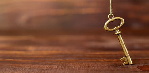 Antique success key. Life coaching, mentor, solution banner or background.
