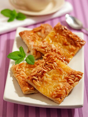 Coca with custard and almonds.