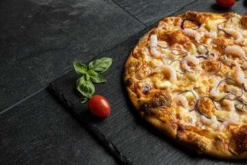 pizza menu on dark plate with stone texture
