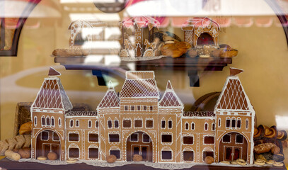 painted gingerbread houses in a store window close-up
