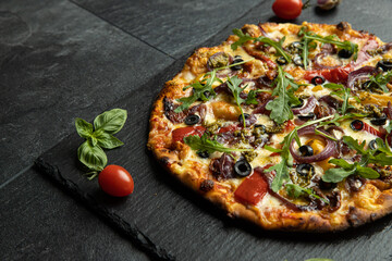 pizza menu on dark plate with stone texture