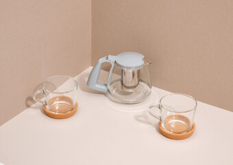 Glass teapot and cups. Lunch or dinner with friends. Elegant dinnerware.