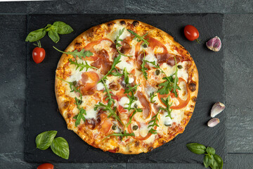 pizza menu on dark plate with stone texture