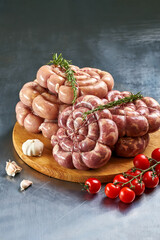 Fresh sausages with various minced meat are prepared for grilling