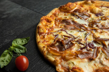 pizza menu on dark plate with stone texture