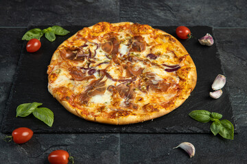 pizza menu on dark plate with stone texture