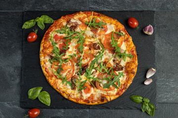 pizza menu on dark plate with stone texture