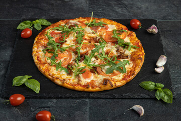pizza menu on dark plate with stone texture