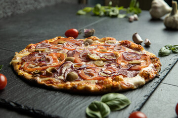 pizza menu on dark plate with stone texture