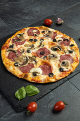 pizza menu on dark plate with stone texture