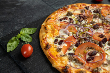 pizza menu on dark plate with stone texture
