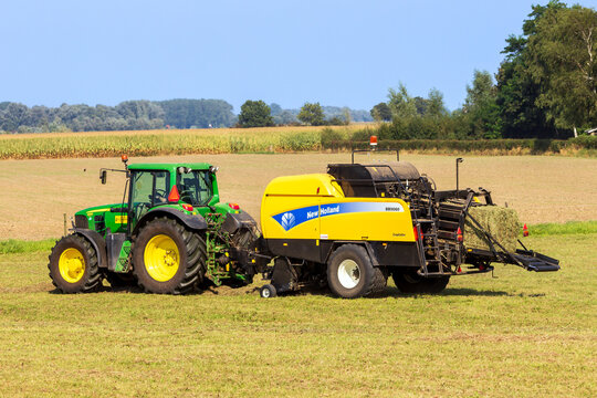 John Deere 6930 tractor and New Holland BB9060 CropCutter hay baler at work