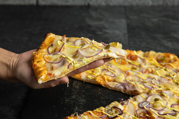 pizza menu on dark plate with stone texture