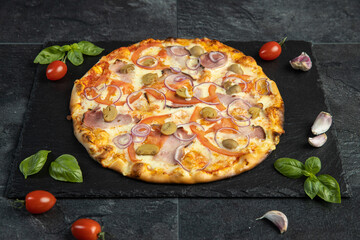 pizza menu on dark plate with stone texture