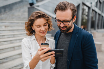 man and woman business partners working together