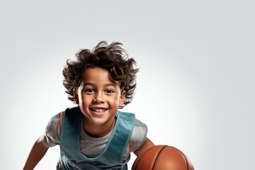 young boy, basketball player in sportswear training, jumping and throwing ball against black studio background. Concept of sport, competition, hobby, game, competition - obrazy, fototapety, plakaty