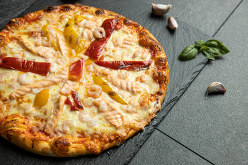 pizza menu on dark plate with stone texture