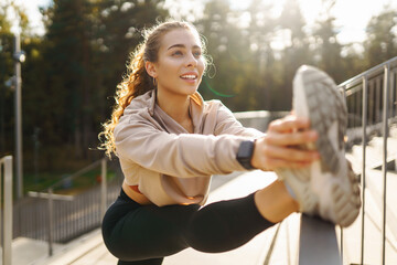 Athlete woman having training outside, doing stretching. Sport, Active life, sports training,...