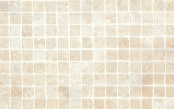 beige Mosaic Tiles wall abstract background texture. Close up. Selective focus. Copy space