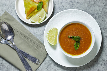 traditional bowl of spiced algerian vegetable soup named (Harira) and meat bourak named bourek. ramadan kareem