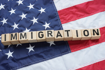 Fototapeta na wymiar Immigration in USA is shown using the text on the flag of USA. Immigration reform and law