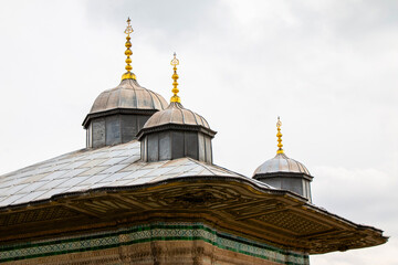 Fototapeta na wymiar Symbol of Islam on dome of mosque. Silhouettes of Islamic baths and minarets.
