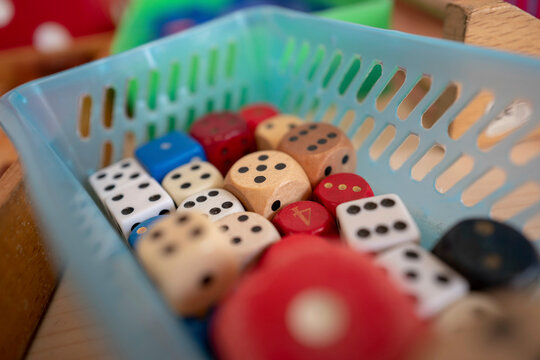 a bowl of dice at a pre school table